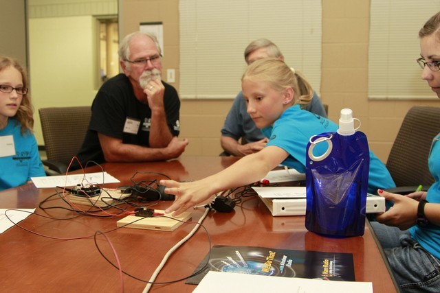 Campers learning Morse Code